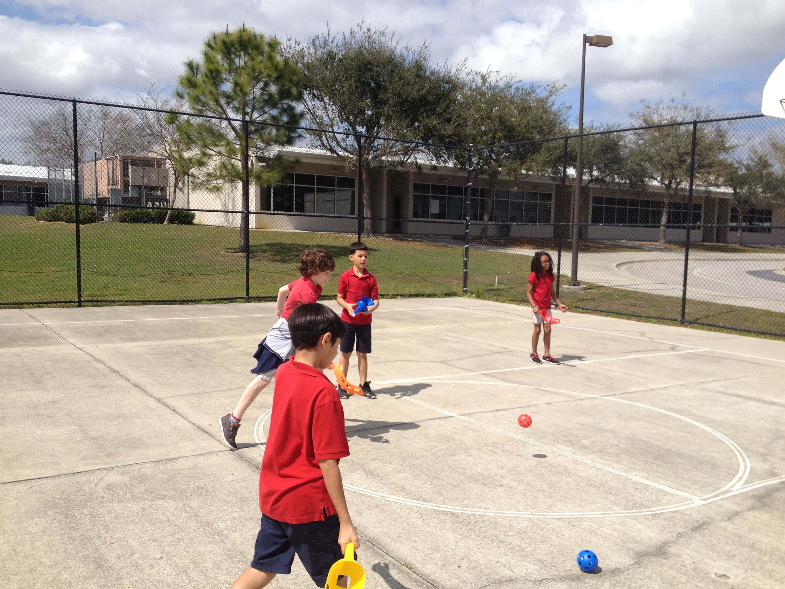 Students playing a catch and release type game for P.E.