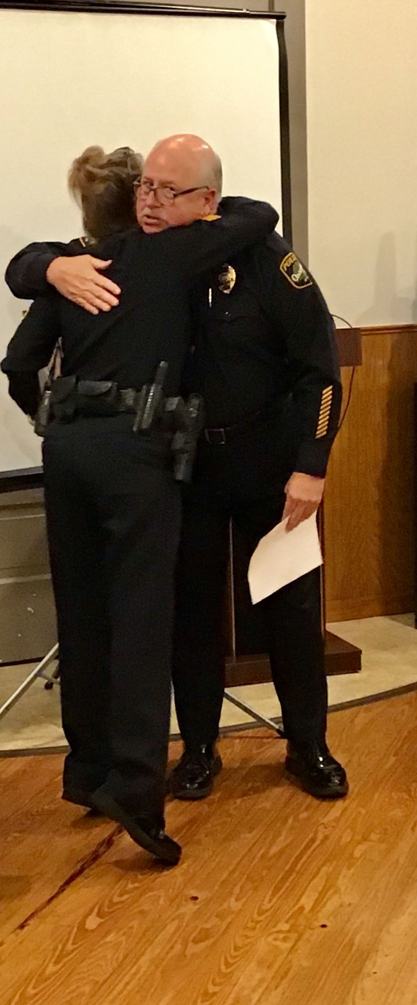 Sergeant Campbell hugs Chief Thomas