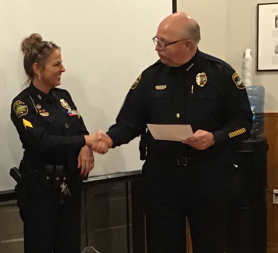 Chief Thomas shakes Sergeant Campbell’s hand