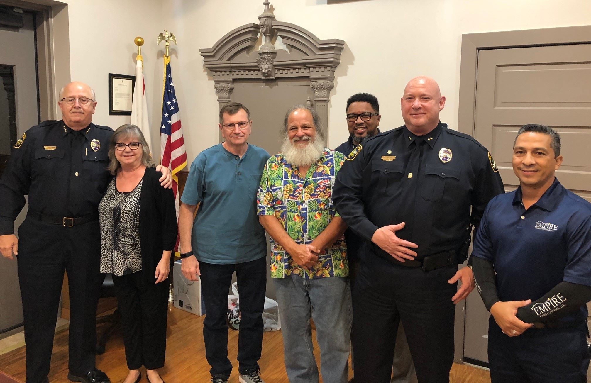 Chief Thomas surrounded by the Town Commission
