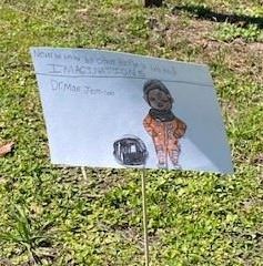 A close up of student artwork and quote about Mae Jemison. 